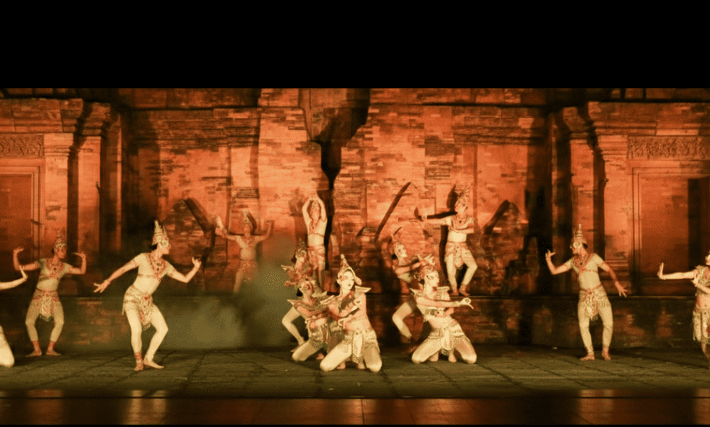 Dancers often wear vibrant silk outfits, intricate jewelry, and tall headdresses, creating a scene that’s both regal and graceful